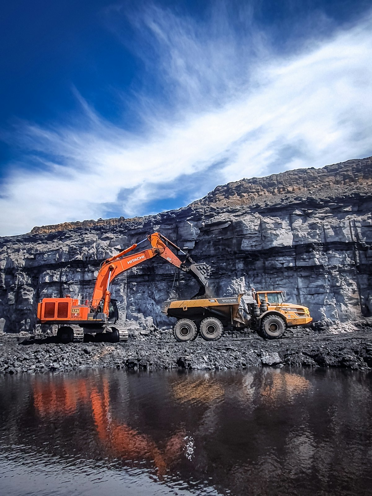 The training site mirrors a real crush-and-haul circuit — synthetic data, realistic constraints.